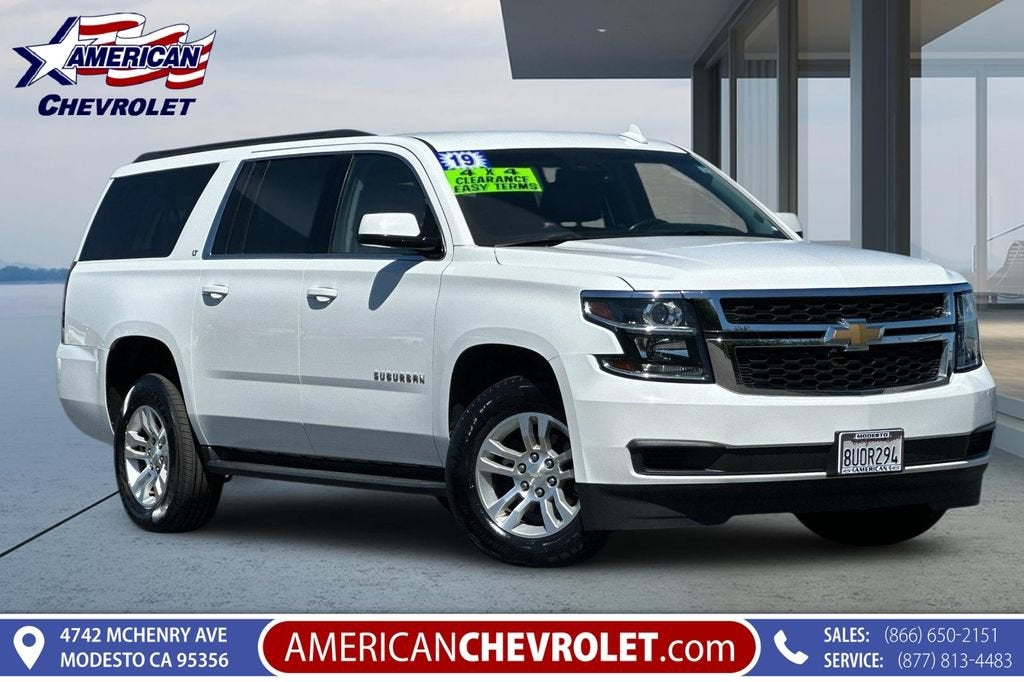 2019 Chevrolet Suburban LT in Summit White — front three-quarter view