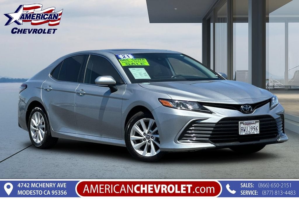 2021 Toyota Camry LE in Celestial Silve — front three-quarter view