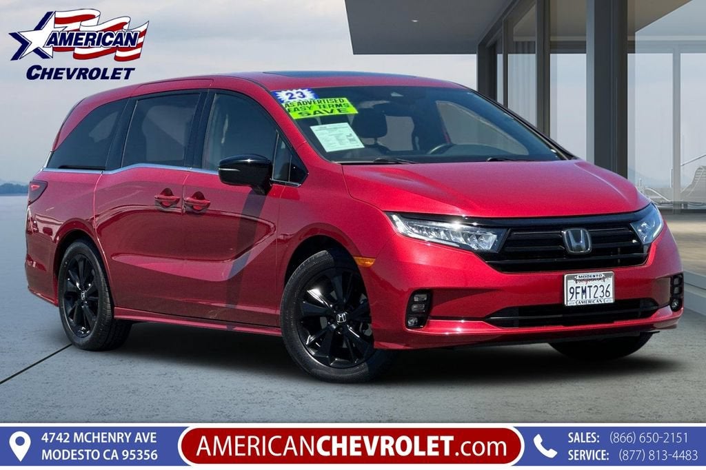 2023 Honda Odyssey Sport in Red — front three-quarter view