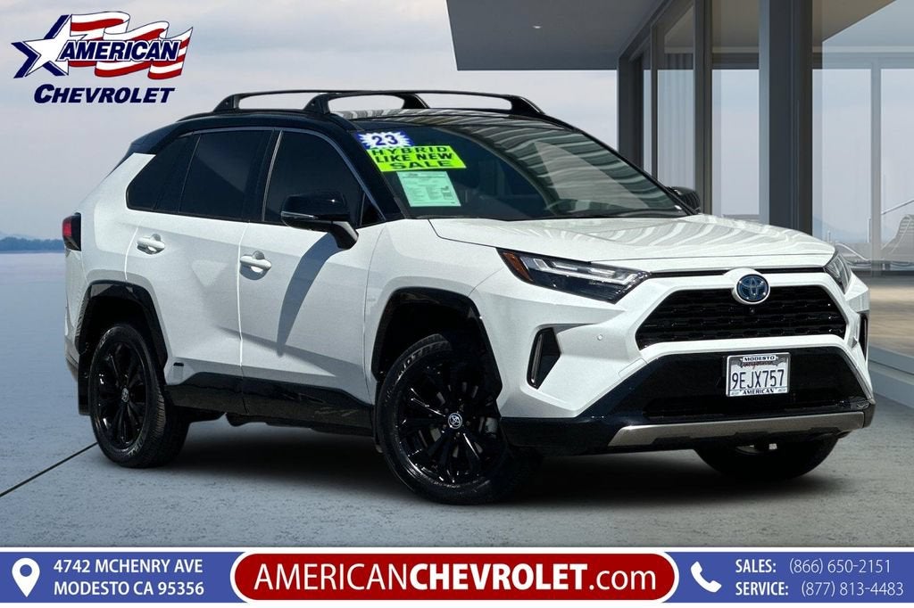 2023 Toyota RAV4 Hybrid XSE in Wind Chill Pearl/Midnight Black Metallic — front three-quarter view