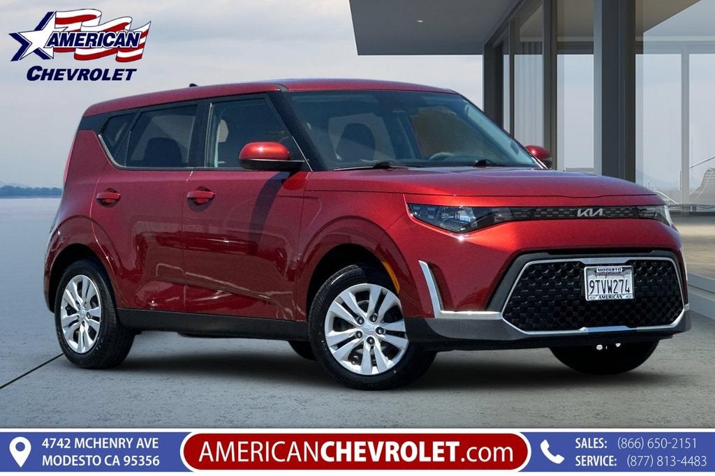 2025 Kia Soul LX in Mars Orange — front three-quarter view